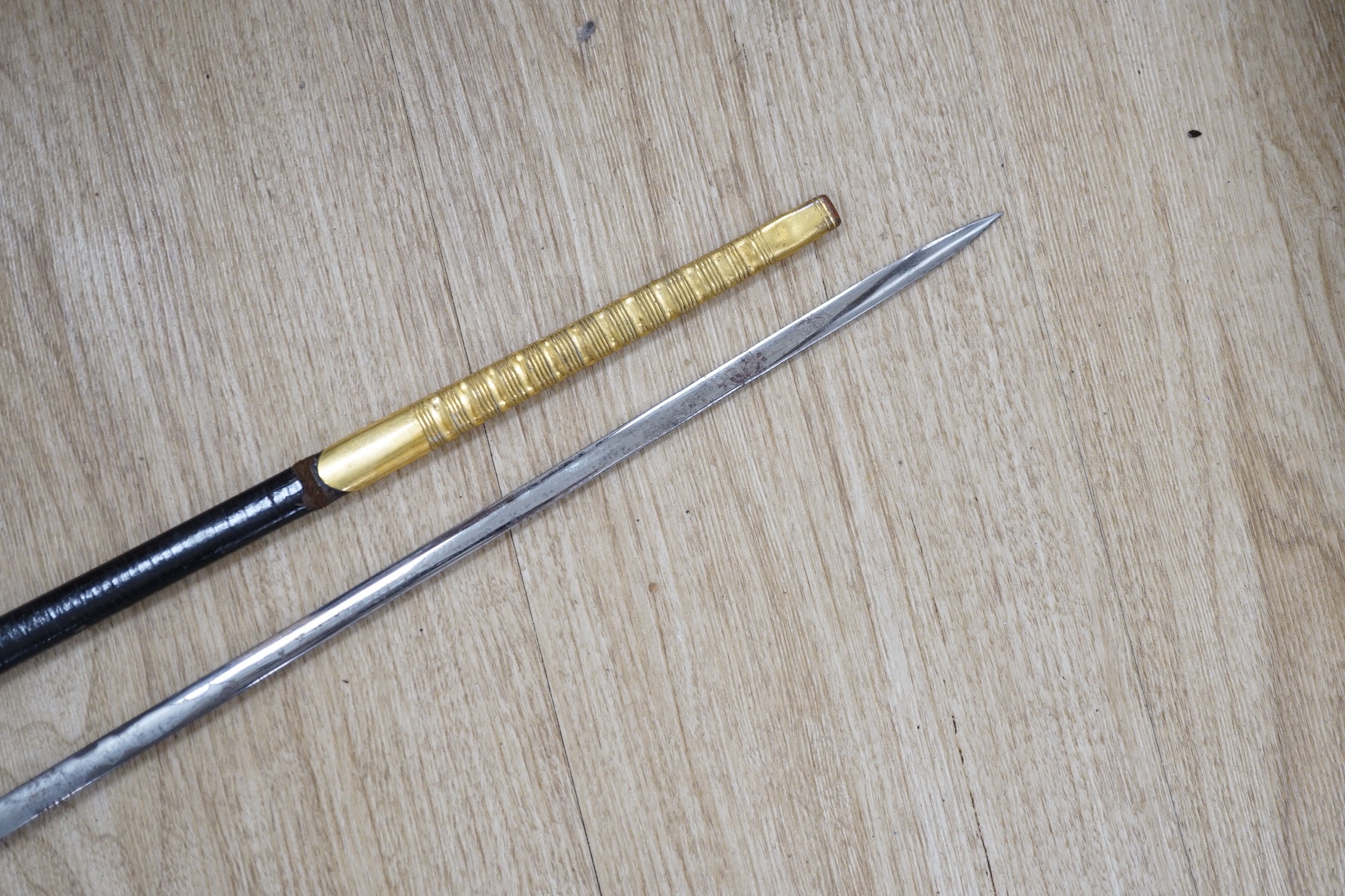 A 19th century officer's dress sword, made by Silver &Co. London with scabbard and leather cover